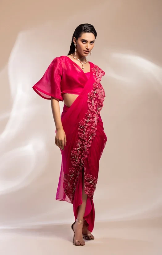 Fuschia bustier half jacket , worn with drape lungi skirt with attached pallu